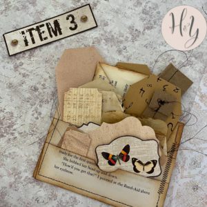 grungy sewn and stuffed book page pockets